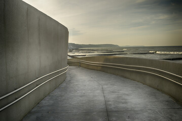 concrete staircase to the sky with dramatic clouds