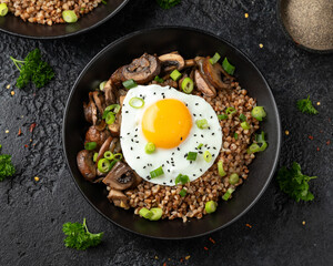 Bowl of Buckwheat with mushrooms, onion and egg. Healthy food