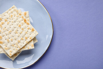 Plate with Jewish flatbread for Passover on color background