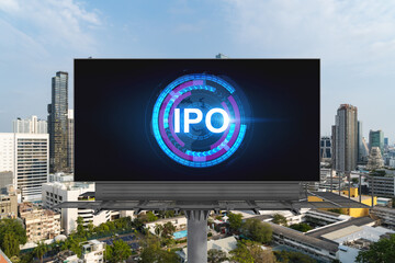 IPO icon hologram on road billboard over day time panorama city view of Bangkok. The hub of initial...