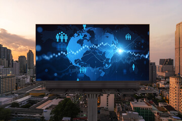 World planet Earth map hologram of social media icons over sunset panoramic cityscape of Bangkok, Southeast Asia. The concept of people connections.
