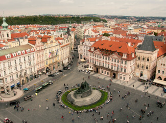 Fototapeta na wymiar Top view to red roofs skyline of Prague city, Czech Republic. Aerial view of Prague city with terracotta roof tiles, Prague, Czechia. Old Town architecture with roofs in Prague