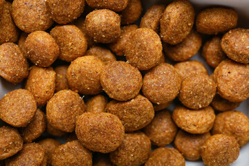 Tasty dry pet food as background, closeup