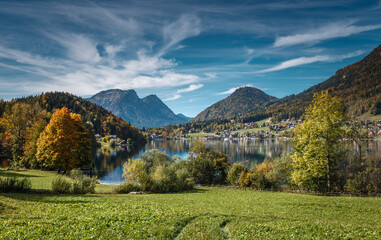 Obraz premium Scenic image of nature landscape. Panorama of lake in mountains. Vivid Scenery in the Alps. Grundlsee lake. Austria. Picture of wild nature, instagram filter.