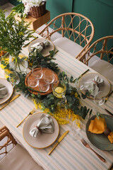 Dining table with beautiful setting and floral decor