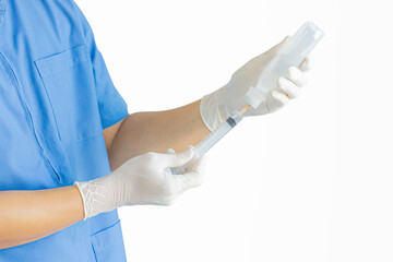 Hands of a doctor or nurse wearing rubber gloves and using a syringe to suck Sodium Chloride in a clinic or hospital alone with a white background.
