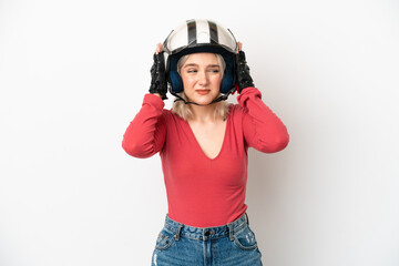 Young caucasian woman with a motorcycle helmet isolated on white background frustrated and covering...