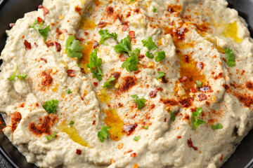 Baba ganoush dip made with grilled aubergine or eggplant, lemon juice, olive oil and tahini. Vegetarian starter food