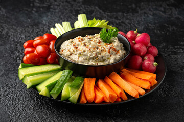 Baba ganoush dip made with grilled aubergine or eggplant, lemon juice, olive oil and tahini. Vegetarian starter food