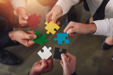 Teamwork of partners connect puzzle pieces as integration and startup