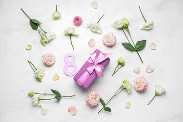 Gift for International Women's Day and many beautiful flowers on light background