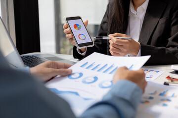 Atmosphere brainstorming session of a startup company, two founders of the company attended a meeting to plan the management and financial growth of the company. Management startup company concept.