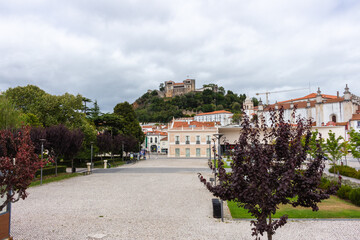 Leiria, Portugal, August 29, 2021: The Paulo VI Square, the Our Lady of the Immaculate Conception Cathedral and Leiria Castle..