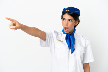 Airplane stewardess caucasian woman isolated on white background pointing away