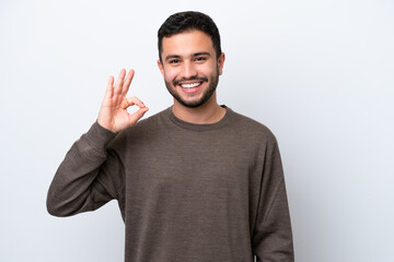 Fototapeta premium Young Brazilian man isolated on white background showing ok sign with fingers