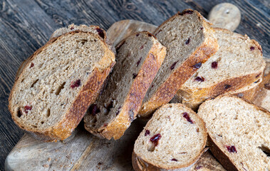fresh cut bread made of flour and dried cranberries