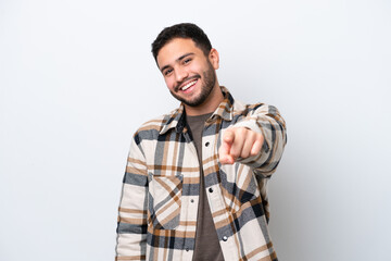 Young Brazilian man isolated on white background pointing front with happy expression