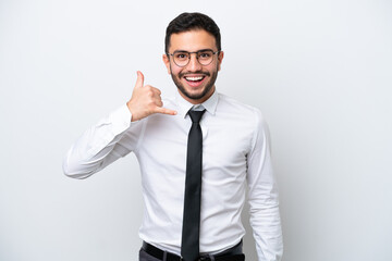Business Brazilian man isolated on white background making phone gesture. Call me back sign