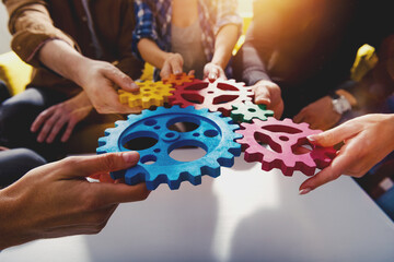 Fototapeta Business team connect pieces of gears like a teamwork and partners obraz
