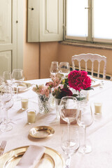 table setting for a wedding celebration with flowers