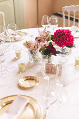 table setting for a wedding celebration with flowers