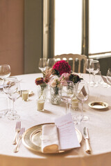table setting for a wedding celebration with flowers