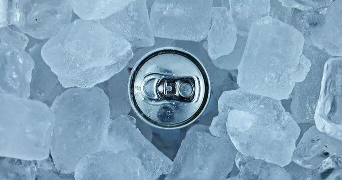Tin can in ice rotating top view closeup footage