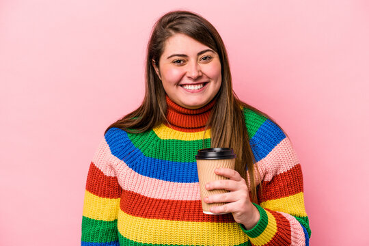 Young Caucasian Overweight Woman Holding Takeaway Coffee Isolated On Pink Background Happy, Smiling And Cheerful.