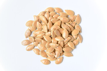 Pumpkin seeds on white background. Close up top view