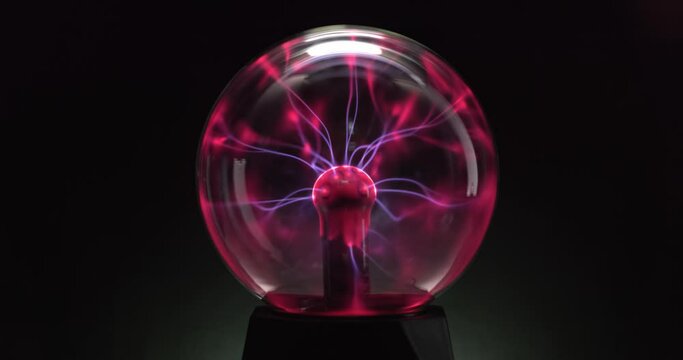 Tesla coil inside glass sphere closeup