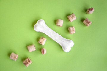 Treats for dogs on a light green background.