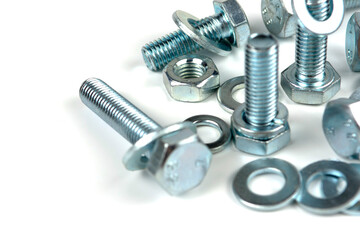metal bolts and nuts with round washers close-up on a white background. copy space