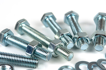 metal bolts and nuts with round washers close-up on a white background