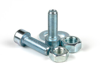 metal bolts and nuts with round washers close-up on a white background