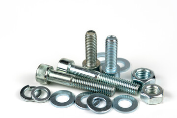 metal bolts and nuts with round washers close-up on a white background