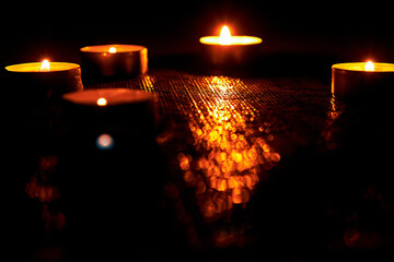 Memorial Day.Burning Candles on a Dark Surface With Soft Light and Bokeh. Memorial Day.The Concept of Grief, Mourning.