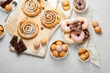 Desserts assortment on light background.