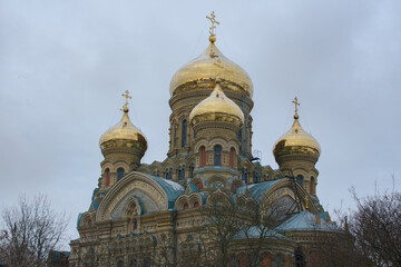 Fototapeta na wymiar Close up of golden domes of The St. Nicholas Naval Cathedral in Karosta, Liepaja at winter. Russian Orthodox cathedral.