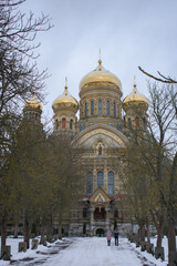 Fototapeta na wymiar The St. Nicholas Naval Cathedral in Karosta, Liepaja at winter. Russian Orthodox cathedral with golden domes.