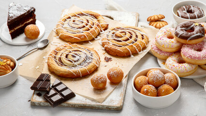 Desserts assortment on light background.