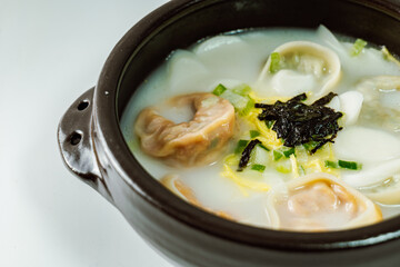 tteok mandu guk, Korean style dumpling soup with sliced rice cake