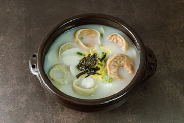 tteok mandu guk, Korean style dumpling soup with sliced rice cake