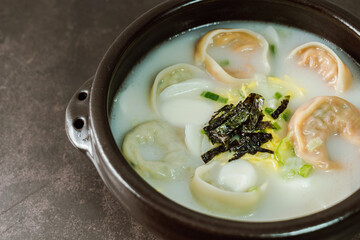 tteok mandu guk, Korean style dumpling soup with sliced rice cake
