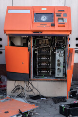 Vandalized and looted ATM. Destroyed automatic transaction machine. Consequences of demonstrations...