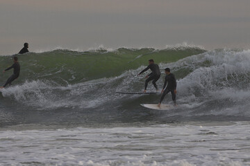 Surfing big winter waves at Rincon point in California