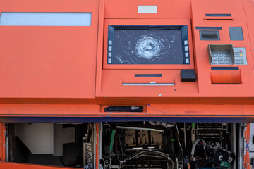 Vandalized and looted ATM. Destroyed automatic transaction machine. Consequences of demonstrations...