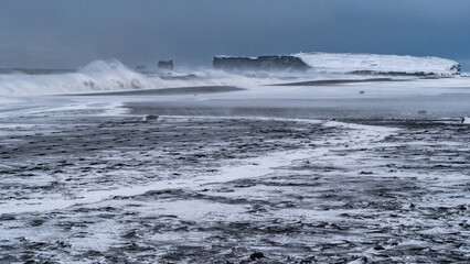 Famous black beach in winter storm
