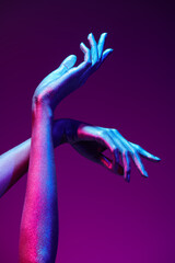 hands in neon light © Andrey Kiselev