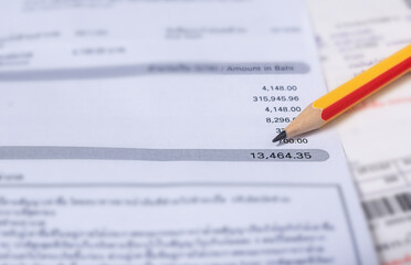 Obraz premium Utility energy bill with pencil blurred background