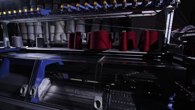 Industrial knitting machine in the workshop knits yarn - 5 angles